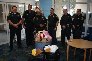 Corpus Christi Police Officers Justin Wicks, Jason Lee, Assistant chief Mike Markle, Captain Ed Shannon, Bob Dorche, and Rodney Cantu delivered stuffed animals and "get well" cards to patients at Driscoll Children's Hospital on December 21.