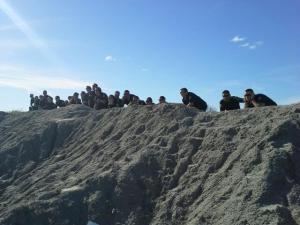 Cadets from the 71st Academy watch the explosives demonstration from a safe distance