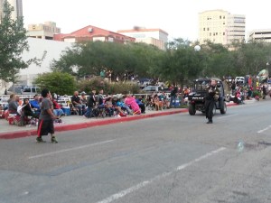 Sandra Gonzalez snapped a picture of Corpus Christi Police Assistant Chief Mark Schauer take time to throw a football with her son Jonathan Jay Gonzalez before the parade began