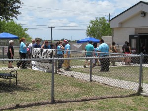 Customers tour the Animal Care Services Shelter on Saturday looking for new pet