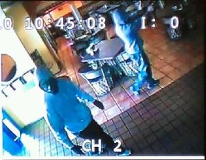 Police are searching for two men who dispalyed a handgun and robbed a restaraunt on Weber Road Monday morning.